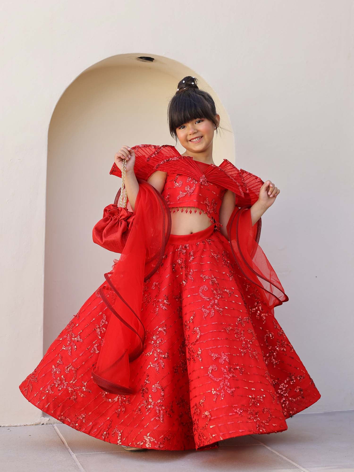 Red luxury sequin lehenga set with dupatta and potli