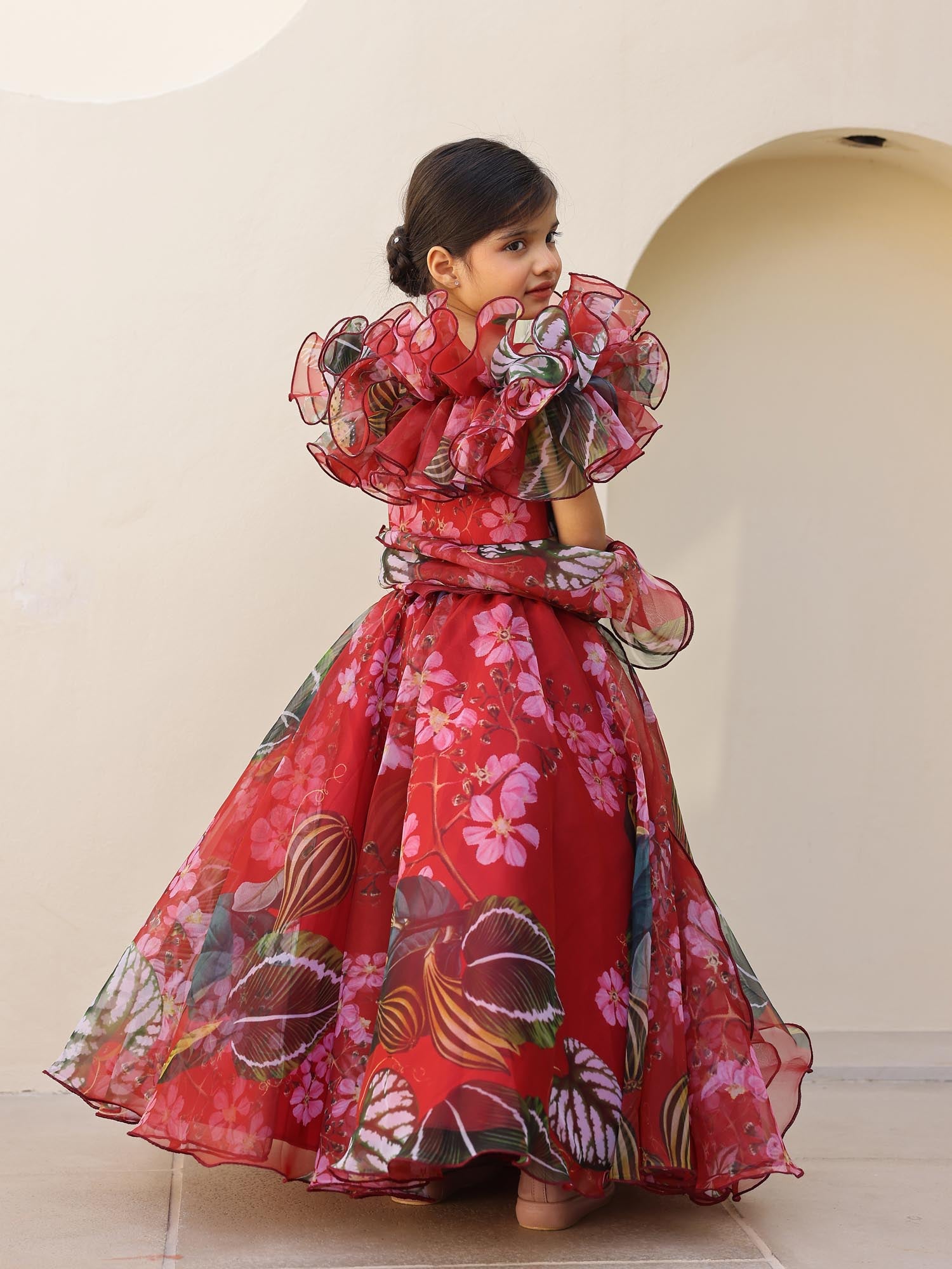Beautiful red floral lehenga set for girls with ruffle detailing and flowy dupatta.