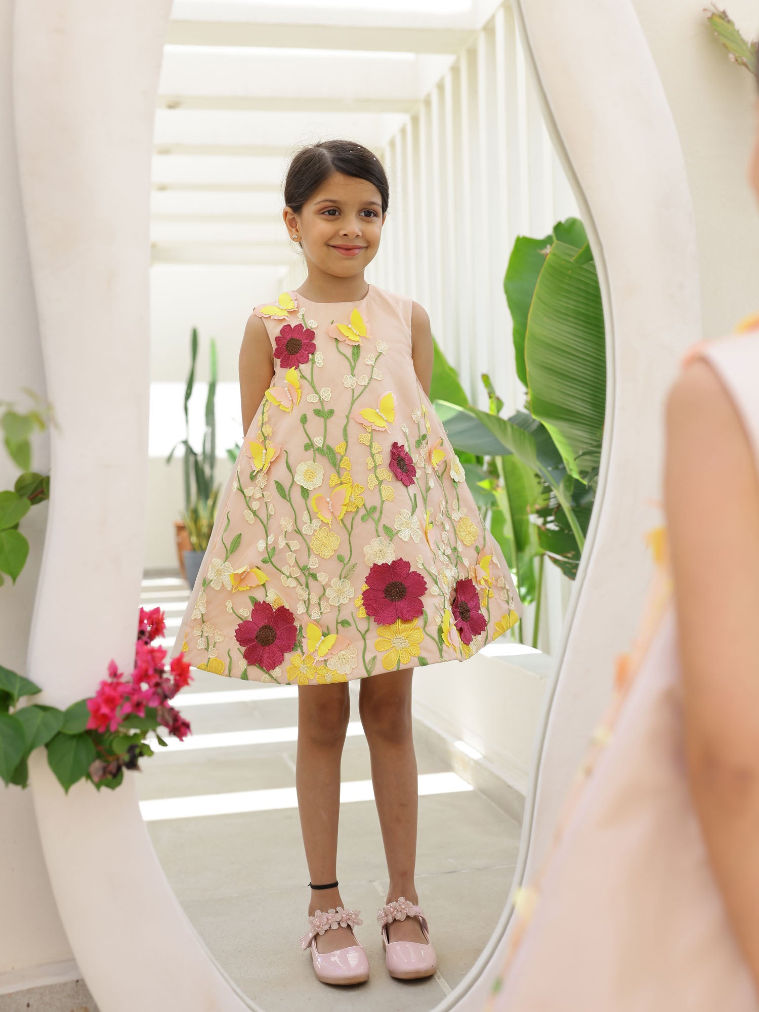 Little girl wearing Peach Magic Blossom 3D Flower Girl Dress with embroidered floral design and A-line silhouette
