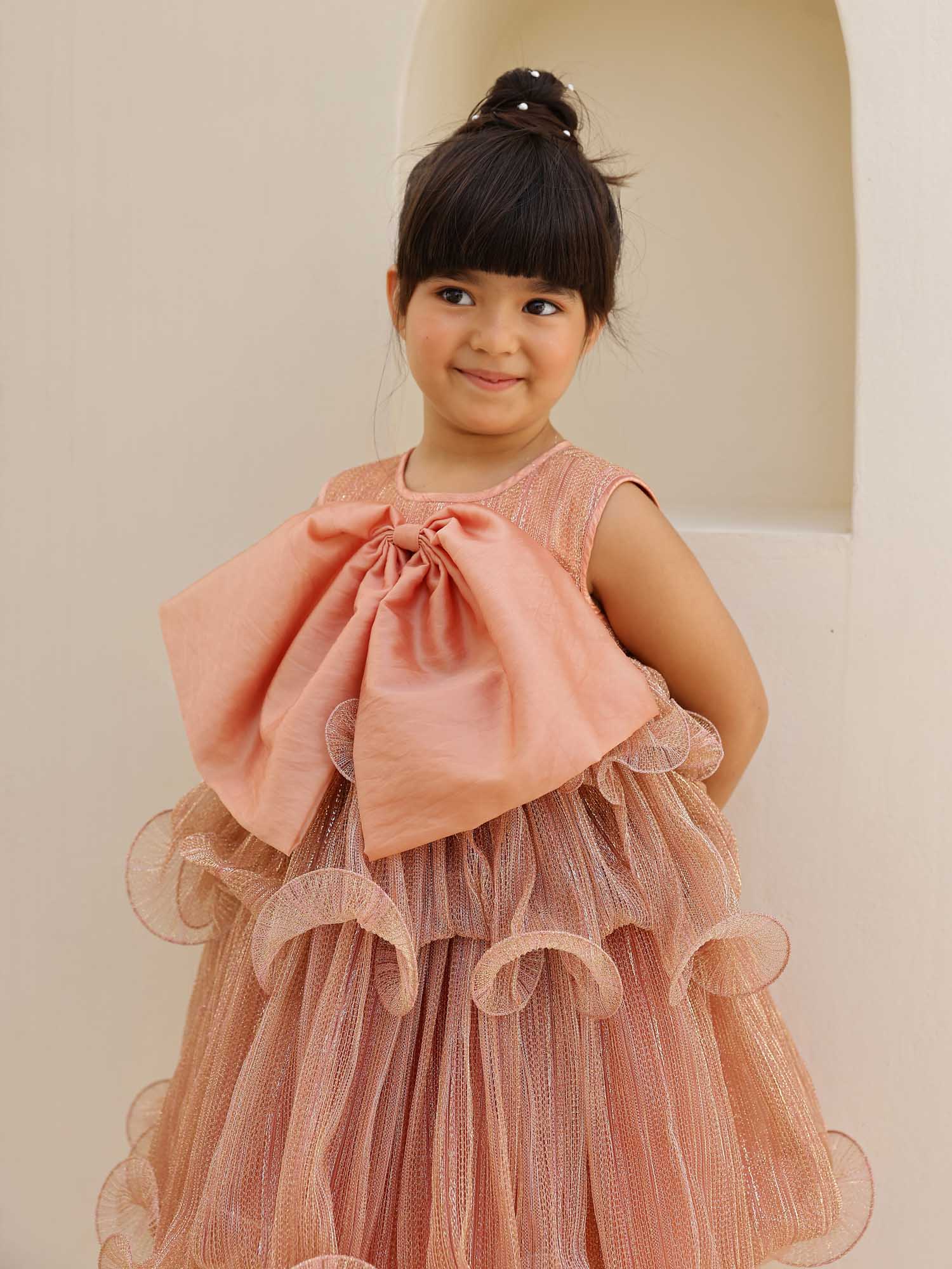 Girl in JANYAS CLOSET Dusty Rose Sparkle Bow Dress.