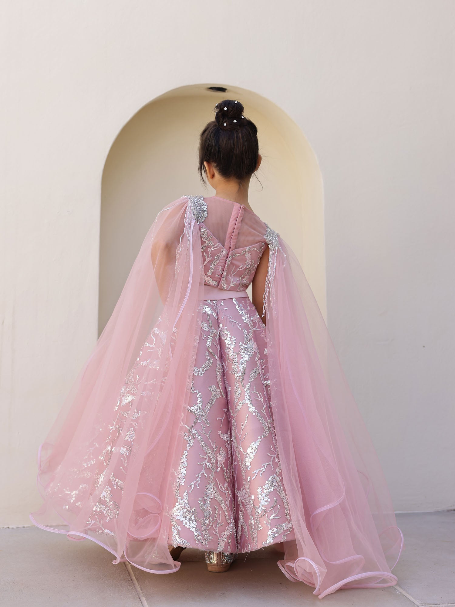 Paired with matching potli bag for luxury look.