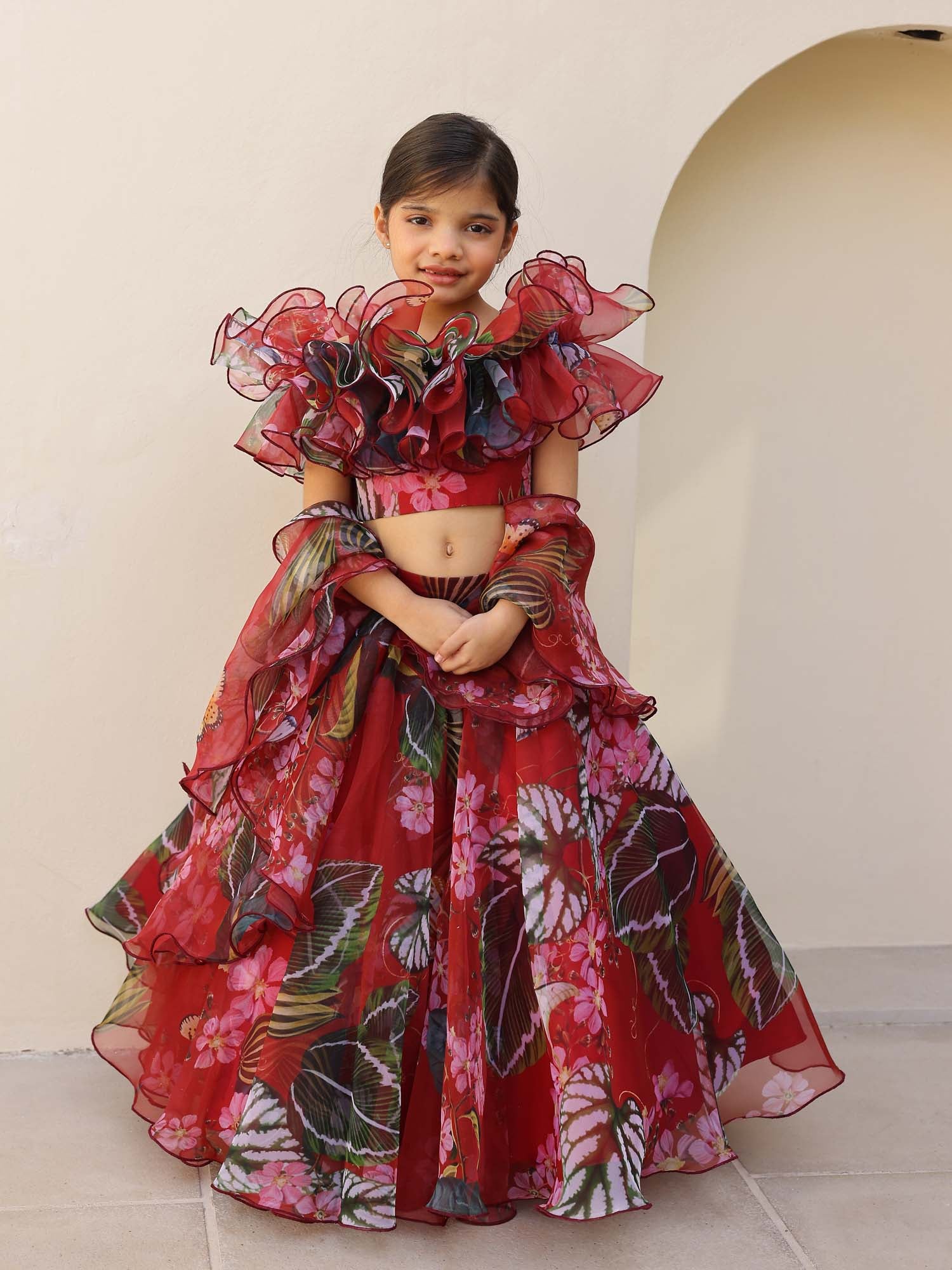 Elegant kids organza lehenga in maroon-red tones, ideal for weddings and festive occasions.