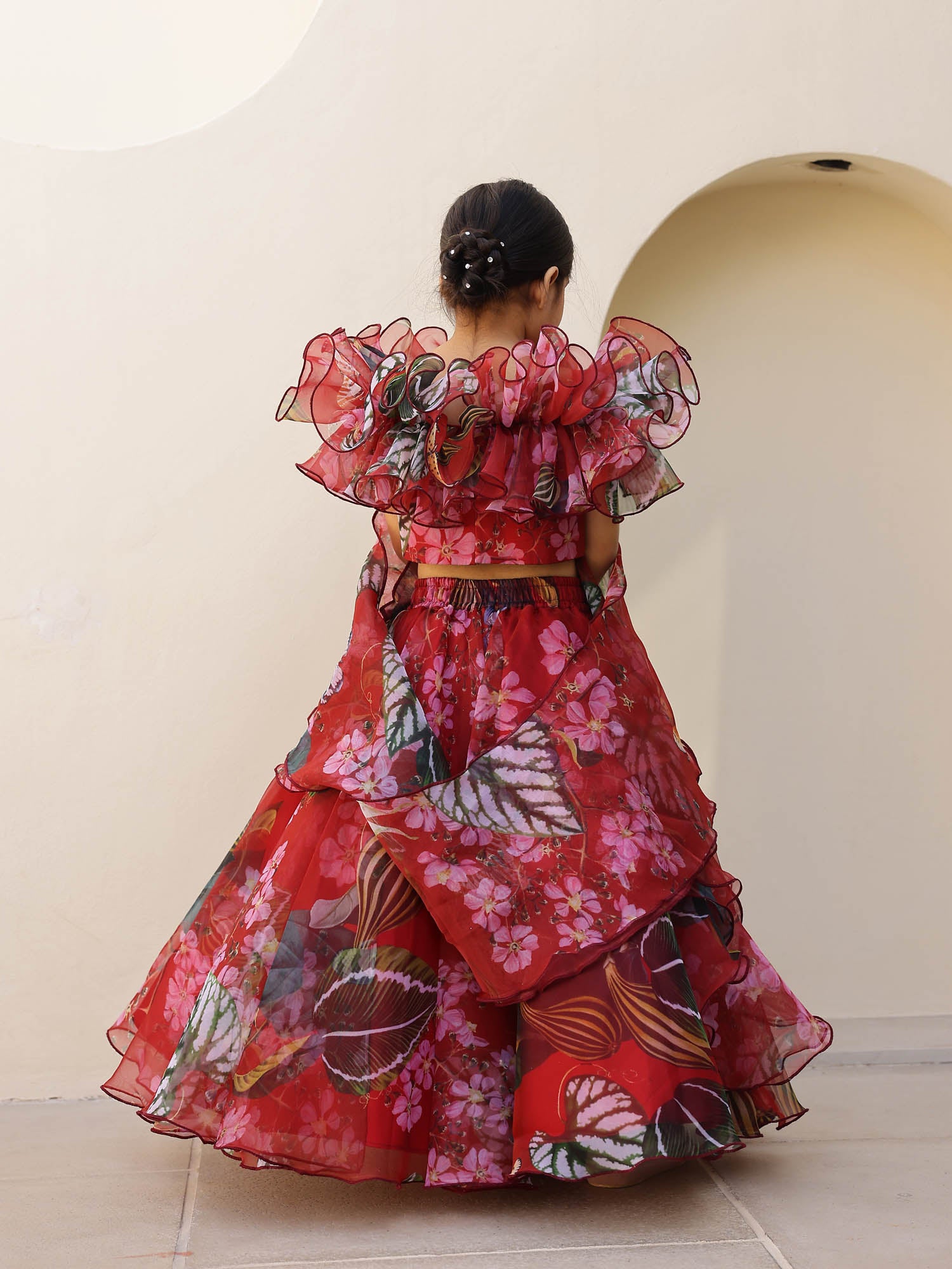 Off-shoulder ruffled neckline lehenga for girls in floral printed organza fabric.